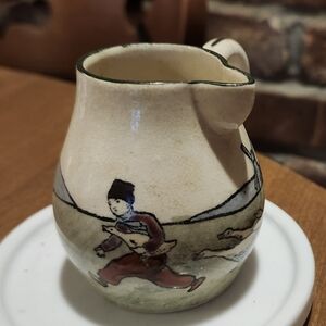 Vintage HAAG Cream Ceramic Pitcher with Artistic Design